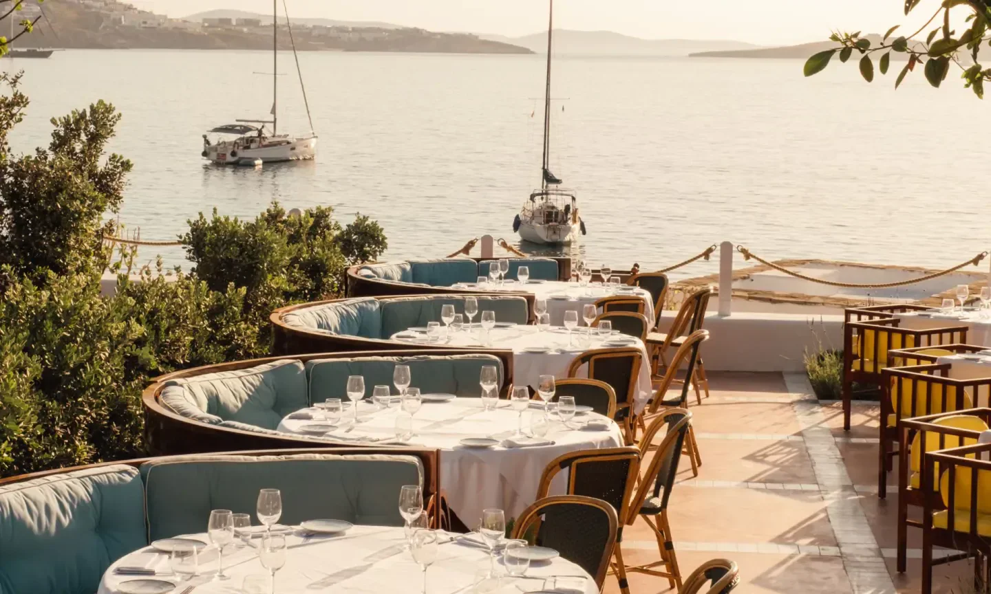 Bagatelle Mykonos: waterfront dining with elegant tables and beautiful sea views