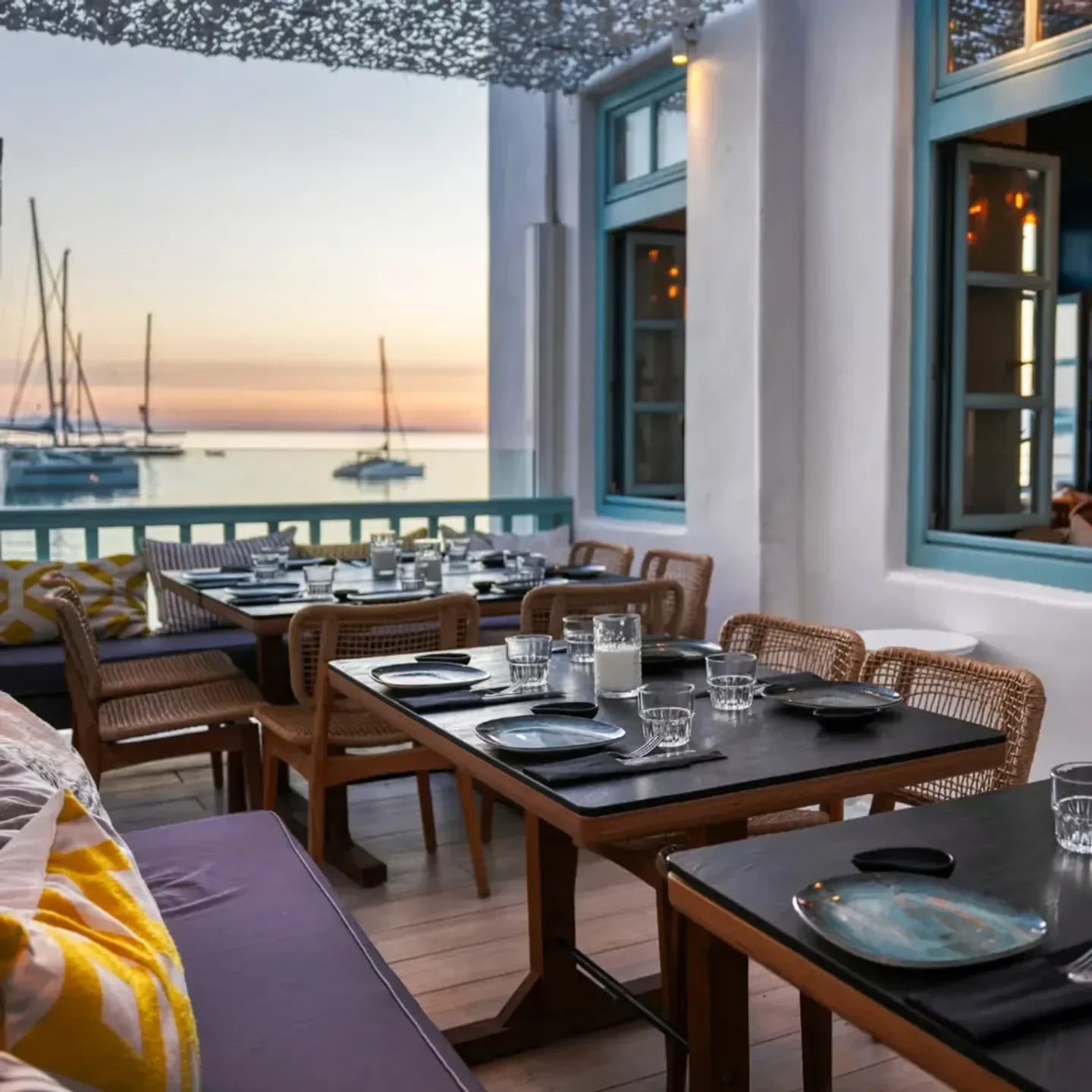 Outdoor dining at Cantera Mykonos with sea views at sunset