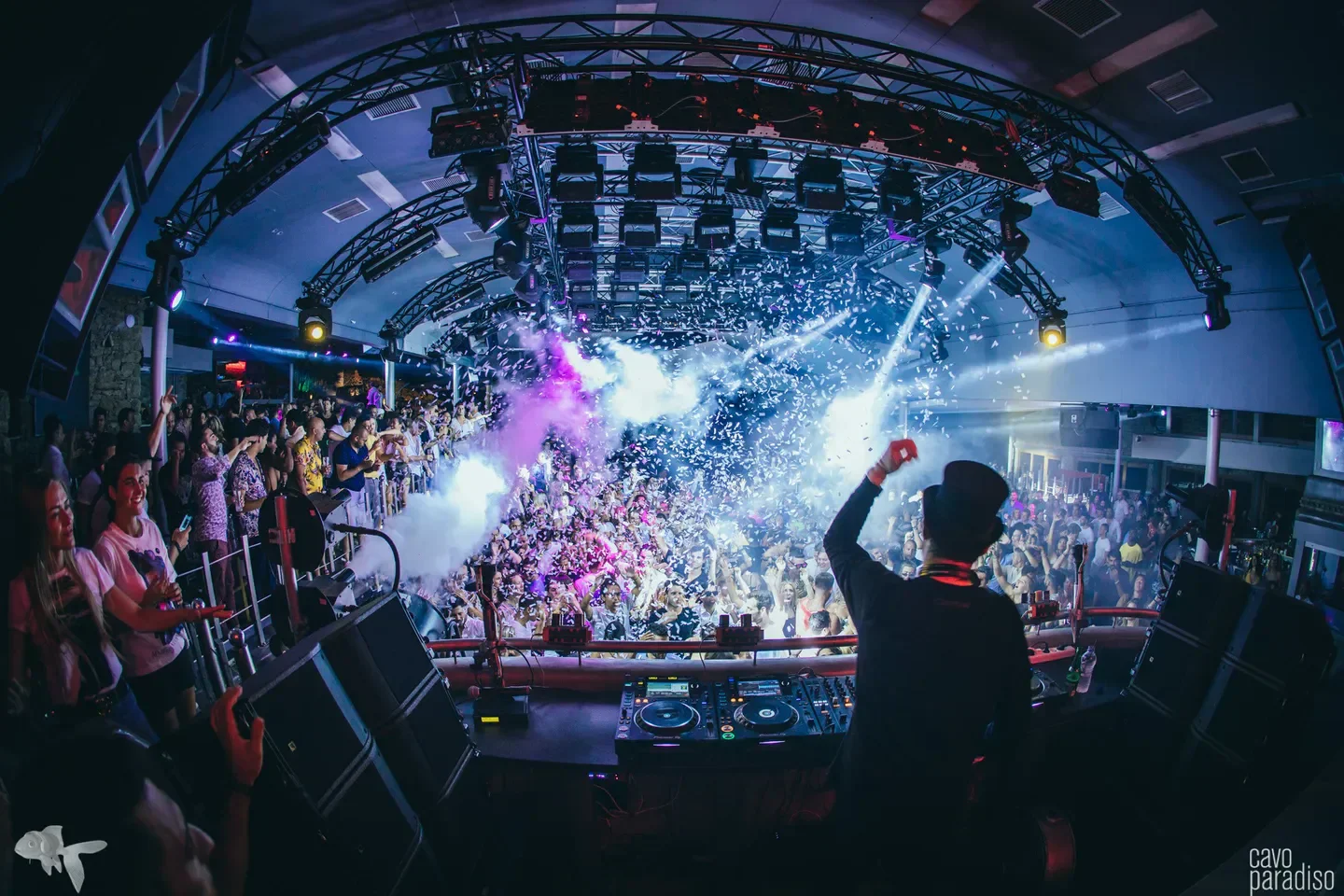 Energetic dance floor at Cavo Paradiso nightclub in Mykonos, with confetti and lights
