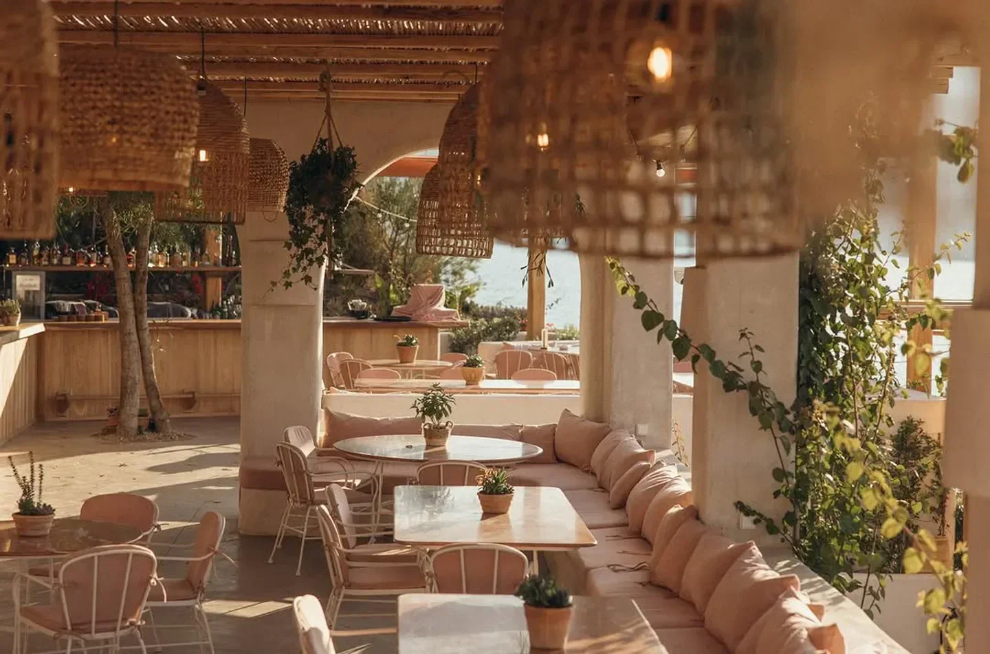 Charming outdoor dining area at Ftelia restaurant in Mykonos, featuring stylish decor.