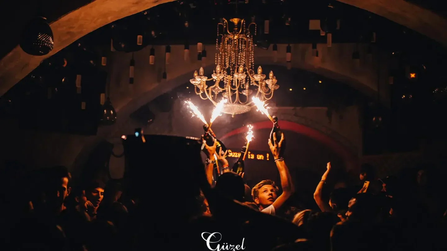Celebratory atmosphere with sparklers at Guzel nightclub in Mykonos, Greece.
