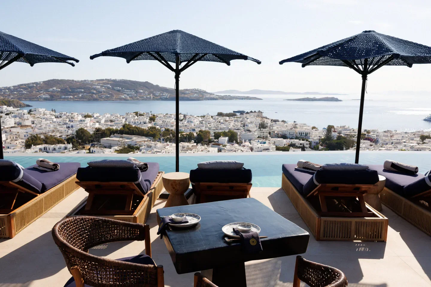 Kiku restaurant in Mykonos, with an infinity pool overlooking the city and sea.