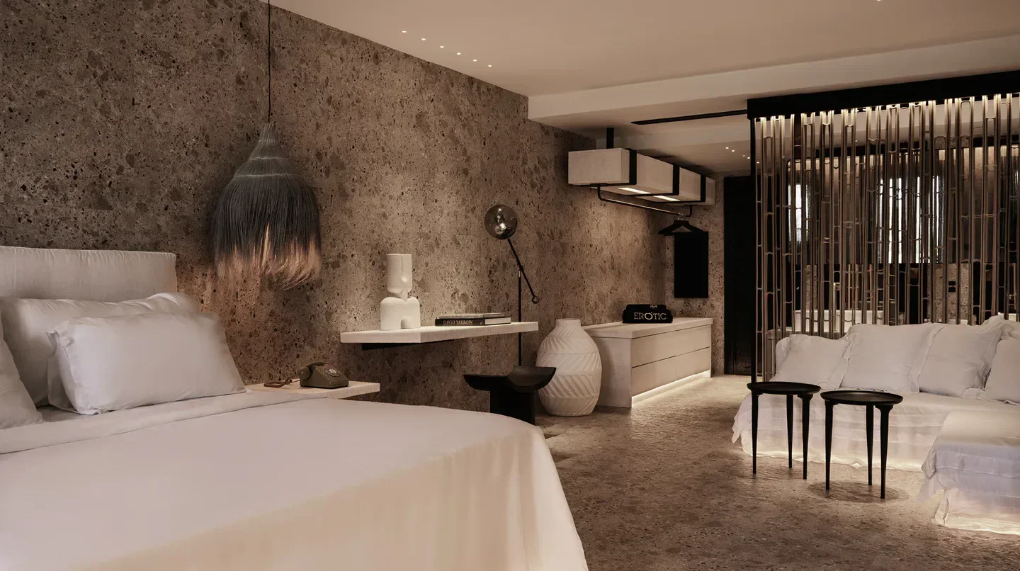 Stylish bedroom interior at Myconian O, Design Hotels in Mykonos, Greece.