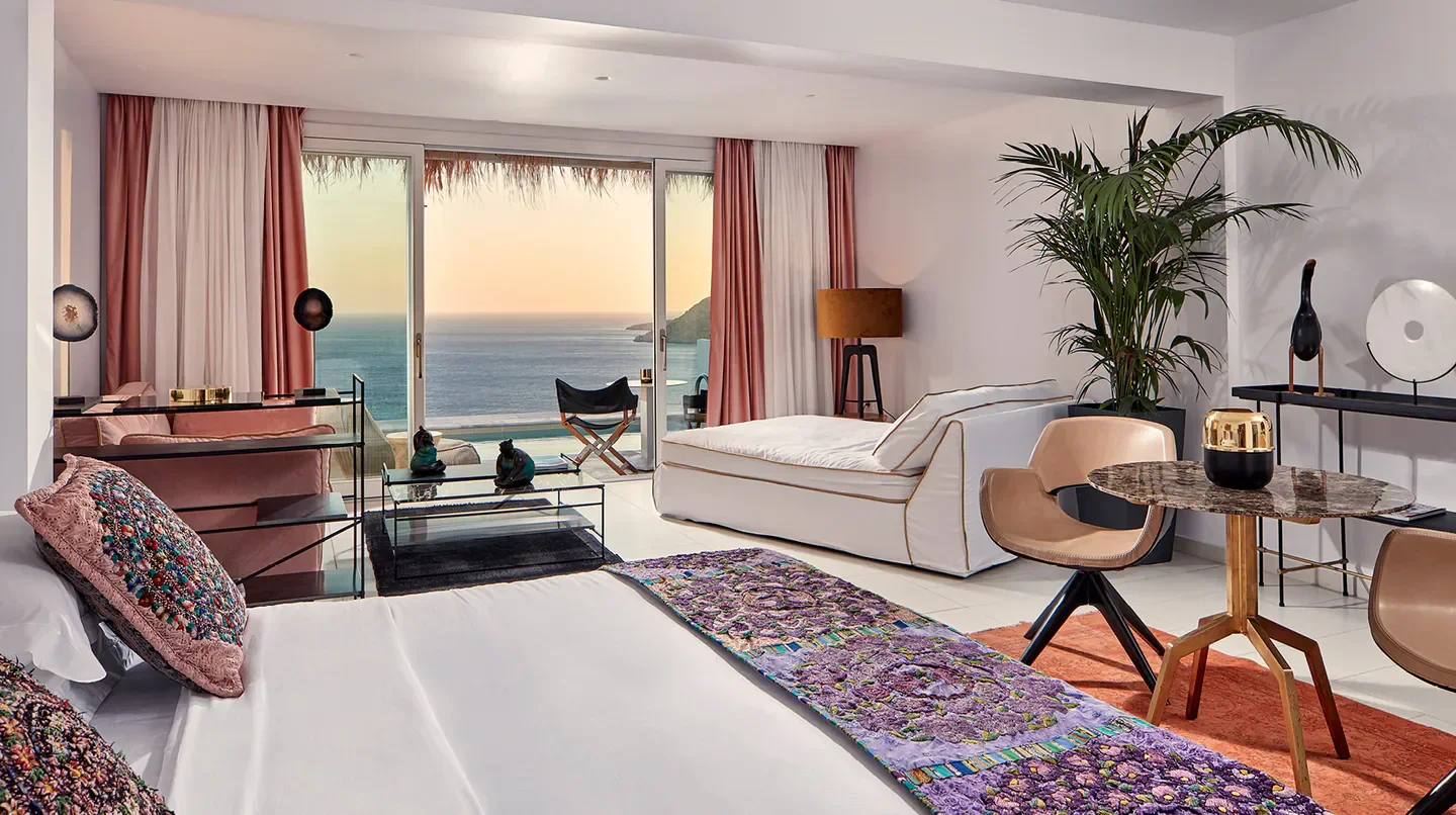 Luxury suite at Myconian Villa Collection in Mykonos with stunning ocean views.