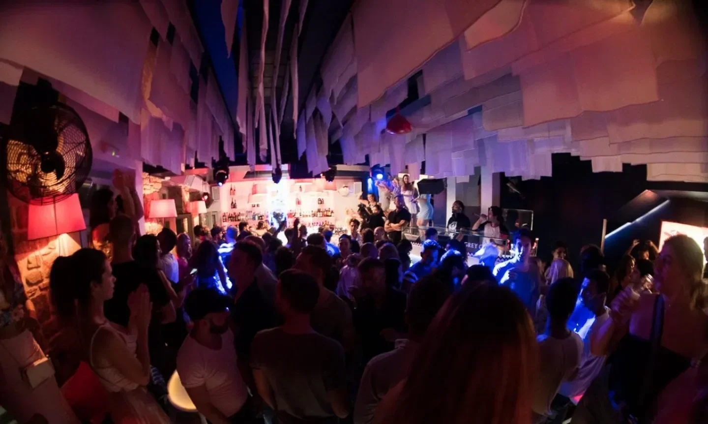 Energetic nightlife at Semeli Mykonos nightclub, with a crowded dance floor and lively atmosphere.